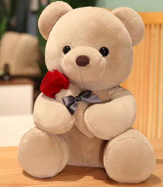 Oreiller peluche ours en peluche avec roses enlacées